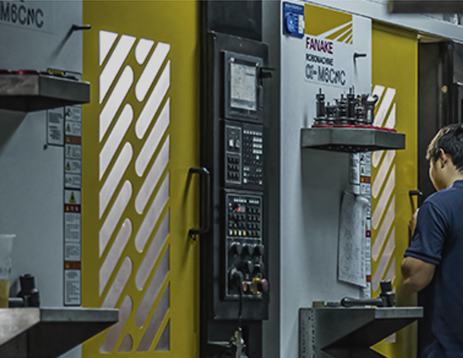 Factory worker operating industrial machinery